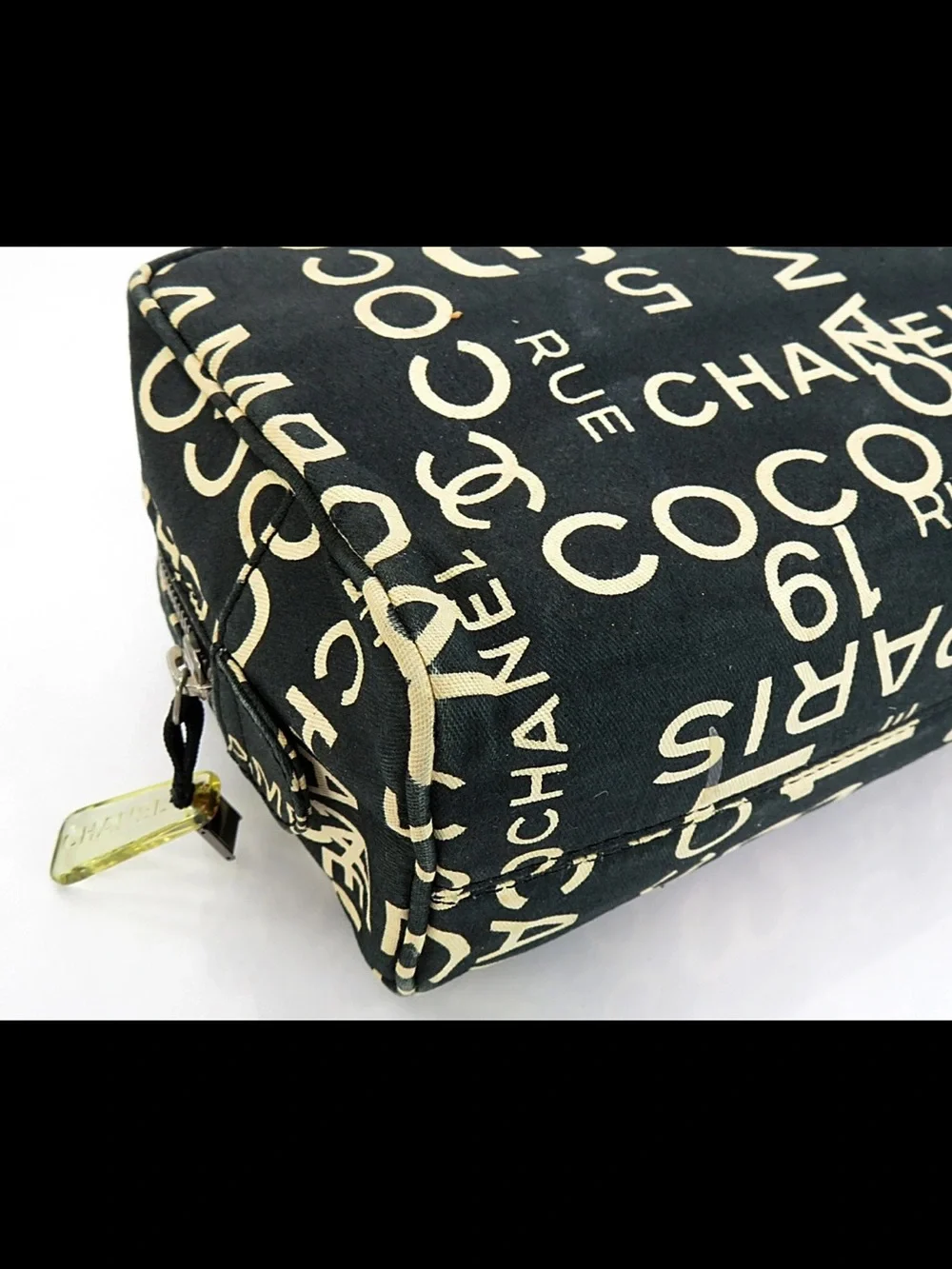 CHANEL Black Canvas Logo Print Cosmetic Pouch with Cream Lettering